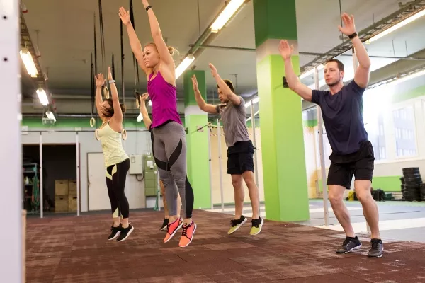 Multiple people doing burpees