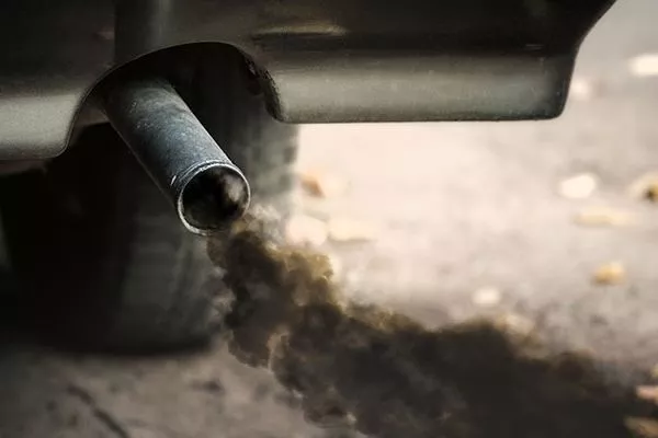 A car emitting black smoke