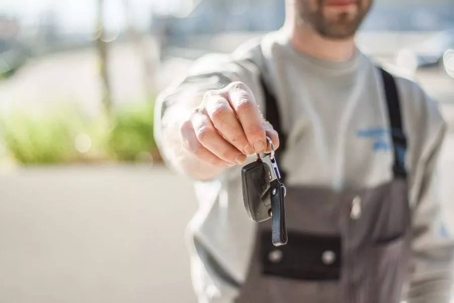 Man handing over a key