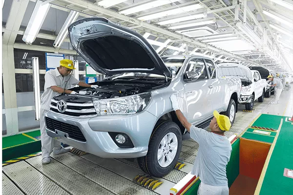 A picture of the a factory building Toyota Hilux units,