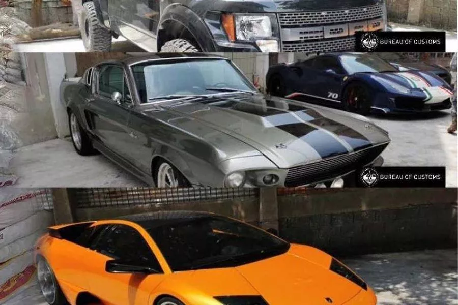 A picture of a front-loader crushing rare luxury cars