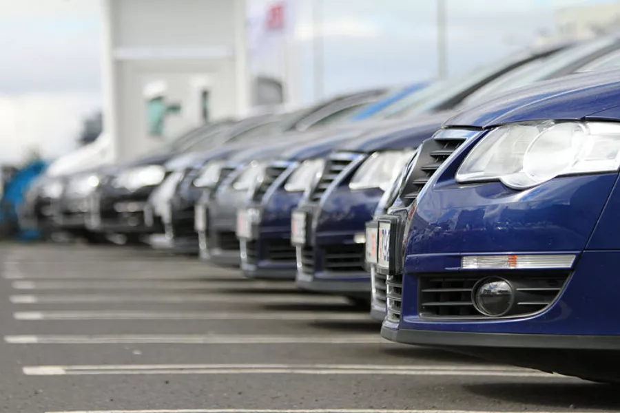 A picture of cars on a car lot.