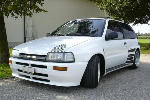 A picture of a heavily modded Daihatsu Charade.