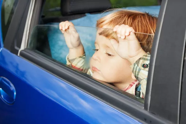 A kid inside a car