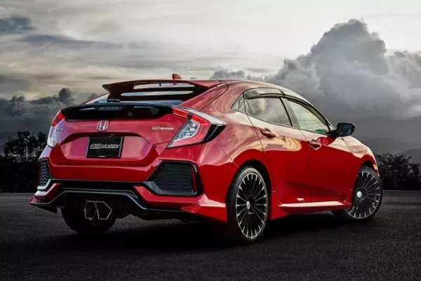 A red Civic Hatchback showing its rear end