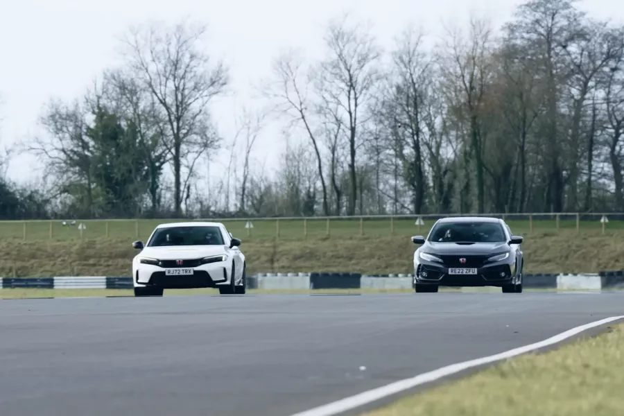 Neck and neck during the rolling drag race A picture of the old and new Civic Type R during the rolling drag race.