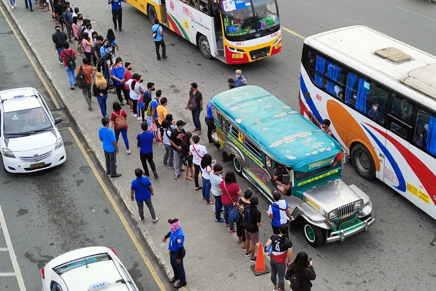 A picture of commuters waiting for a ride