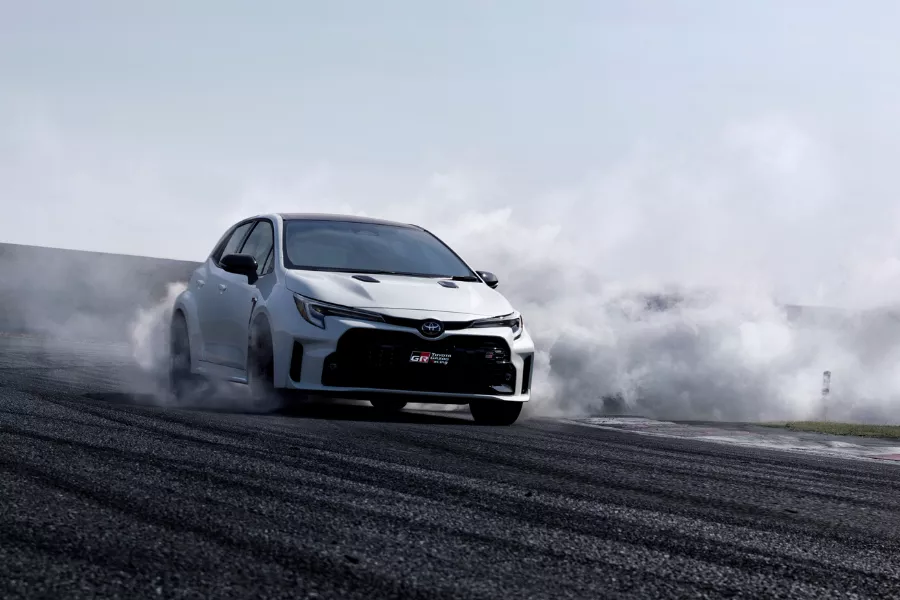 The GR Corolla doing its thing on a race track A picture of a GR Corolla going fast on a race track