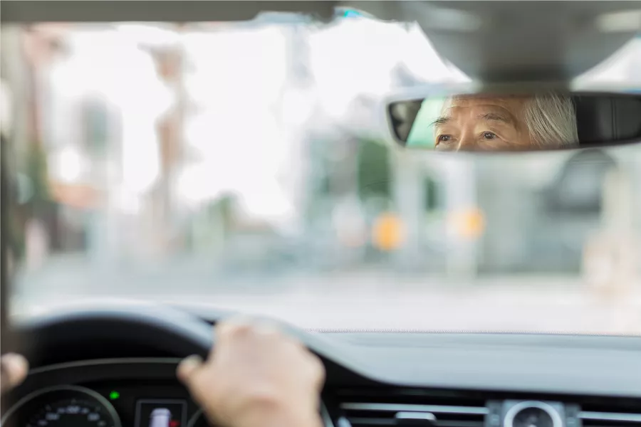 Senior citizen driving car