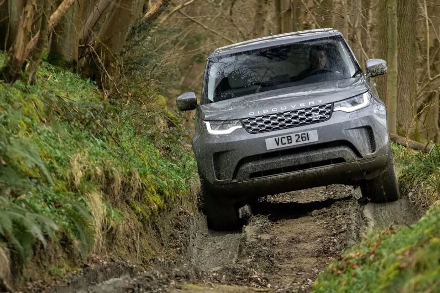 A picture of a 2021 Land Rover Discovery going offroad