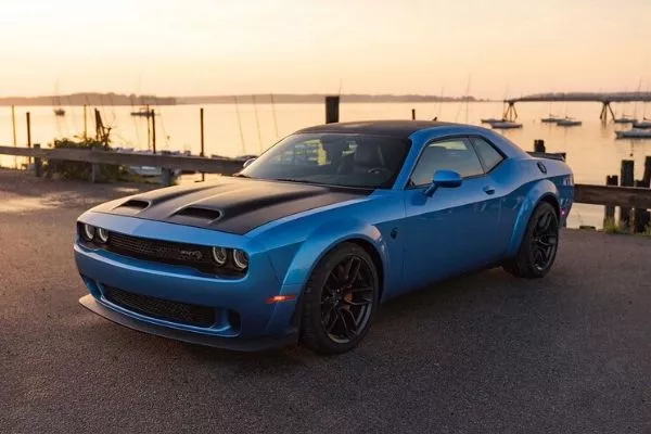 A picture of the Challenger SRT Hellcat Redeye parked near a pier