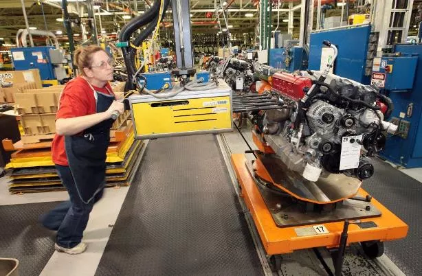 A woman in car manufacturing plant 