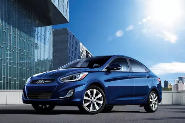 Angular front of a blue Hyundai Accent Sedan