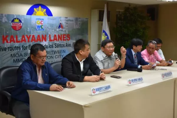 representatives from MMDA and Quezon City LGU at the signing ceremony