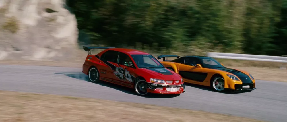The Lancer Evo and RX-7 side by side