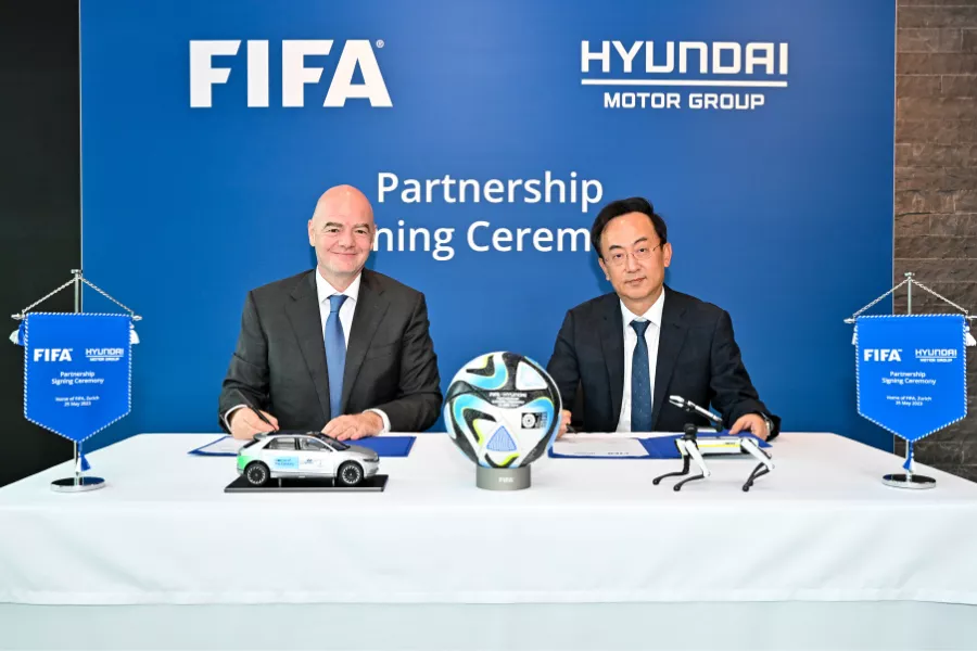 A picture of the FIFA president together with the Hyundai Motor Group President