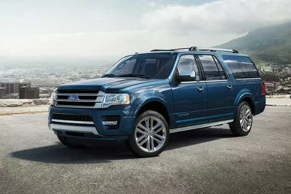 Ford promotional material for the Expedition with the SUV parked near a cliff with a view of the city