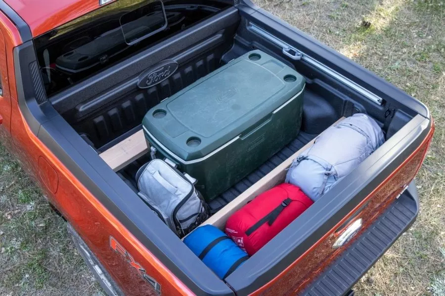 A picture of the Ford Maverick's Flexbed loaded with camping gear