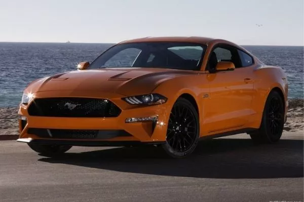 Cruising at highway speeds is no issue for the Mustang GT's V8 A picture of the Ford Mustang GT parked with an ocean backdrop.