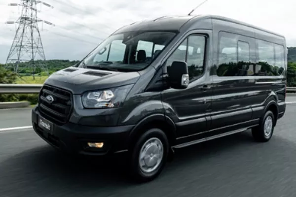 A Ford Transit driving down the road