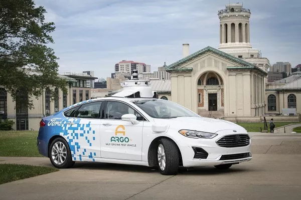 A picture of a sedan with the Argo AI autonomous driving system