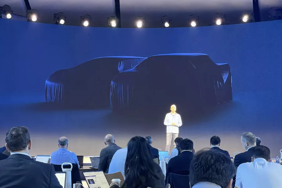 A picture of Doug Field presenting future Ford EV models. 