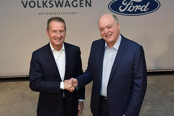 A picture of the Ford and VW ceo's shaking hands