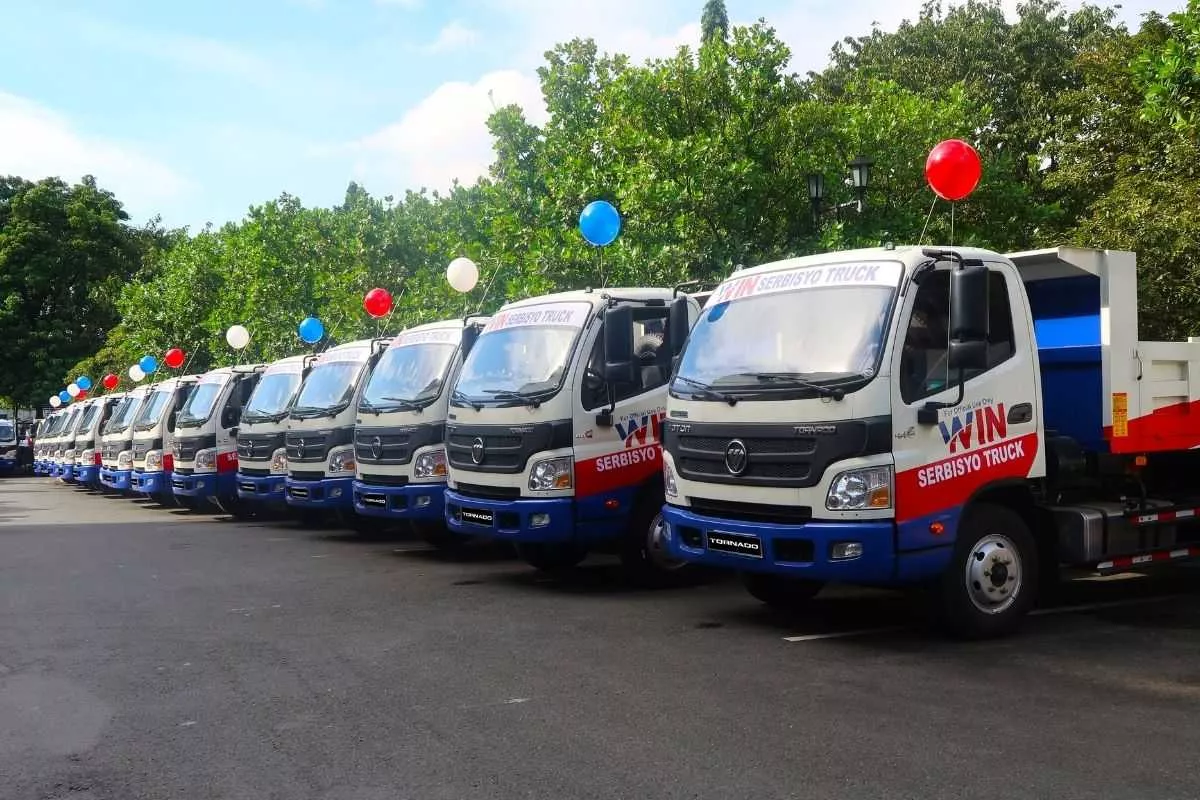 The Foton Tornado mini dump trucks to be distributed to Valenzuela city's barangays A picture of a line of Foton Tornado dump trucks