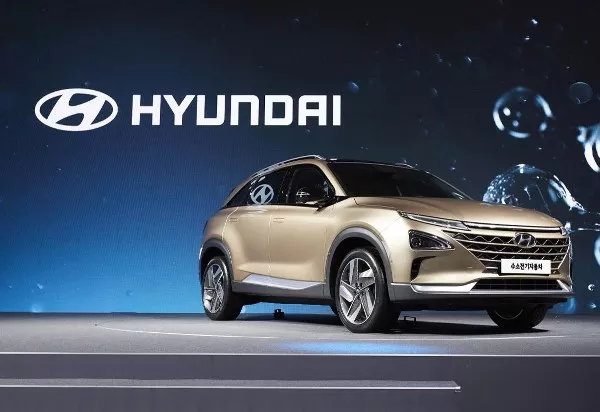 A golden fuel cell SUV angular front view