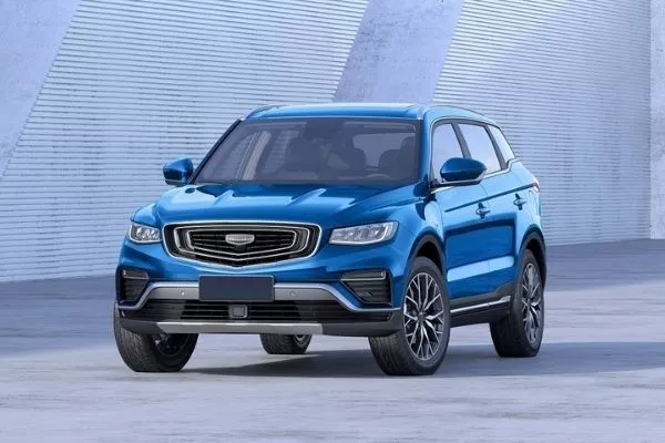 You're not only protected, but you'll look great in the Azkarra too A picture of a blue 2020 Geely Azkarra parked near some modern buildings