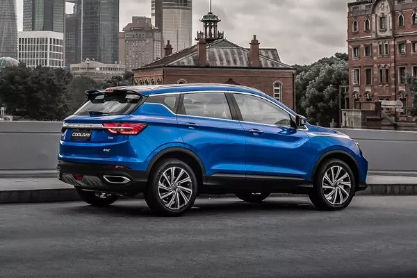 A picture of the side and rear of the Coolray while it's parked on a European city street