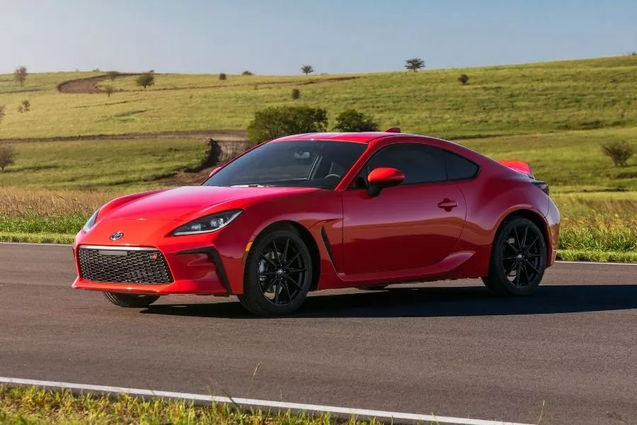 A picture of the US-spec 2022 Toyota GR 86 parked on the middle of a road