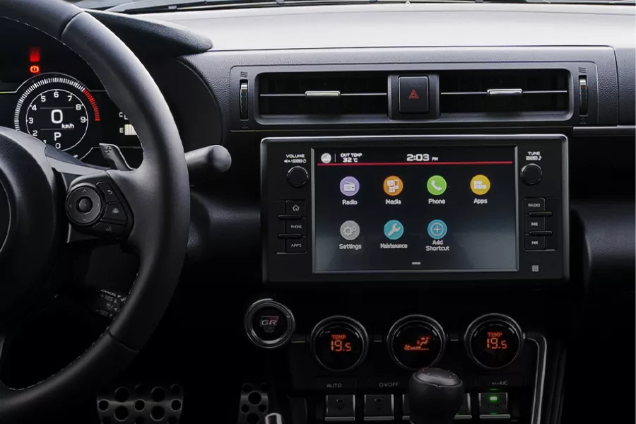 A picture of the Toyota GR86's dashboard highlighting the headunit and AC control knobs