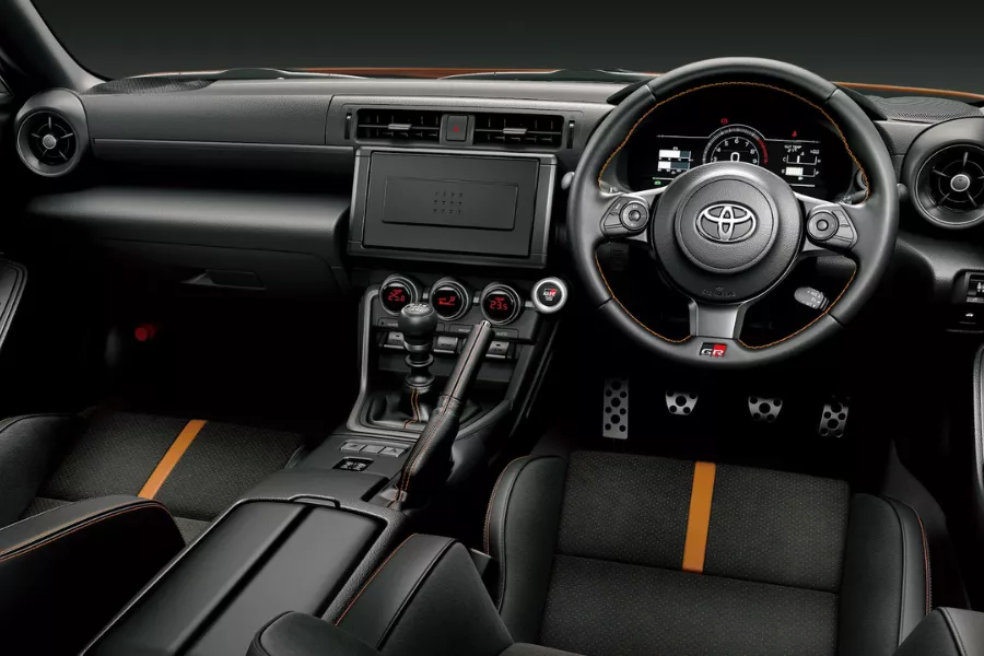 The GR86 RZ 10th Anniversary Edition from the inside A picture of the interior of the 2023 Toyota GR86 RZ 10th Anniversary Edition