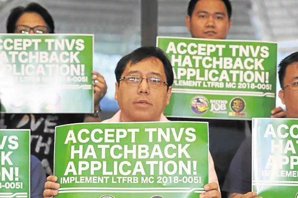 A picture of deactivated hatchback Grab drivers announcing their plight to the world.