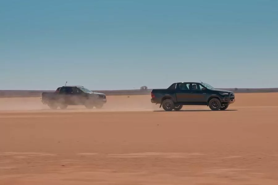 A picture of the Hilux keeping its lead against the Ford Ranger