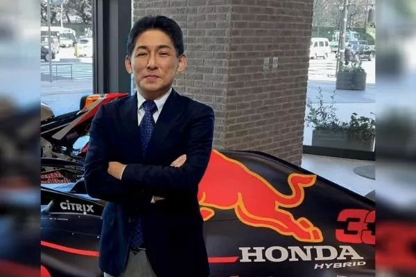 Mr. Masahiko Nakamura with a Honda racing car