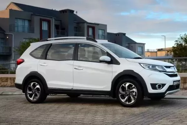 A picture of a white Honda BR-V parked in the suburbs