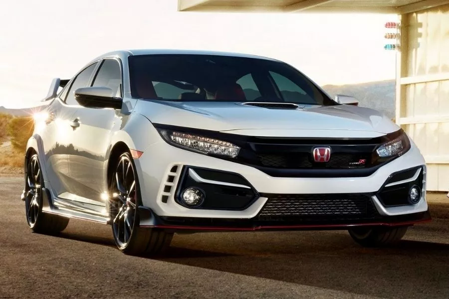 A picture of the Honda Civic Type R parked near a house