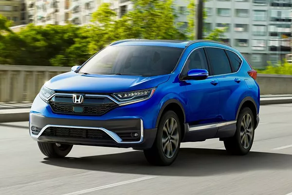 The latest iteration of the Honda CR-V. The 5th-gen CR-V on a road.