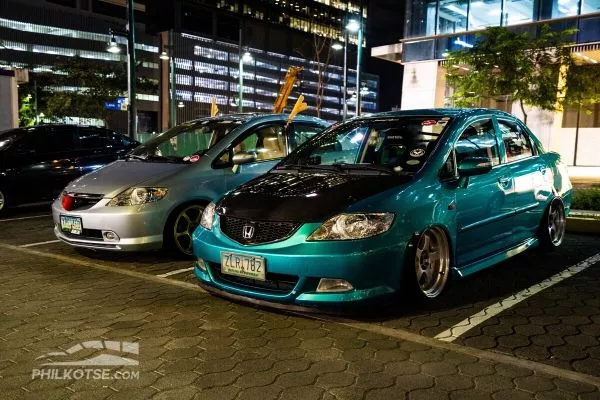 honda city silver and green parked together