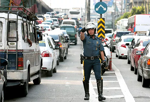 A traffic policeman standing in the middle of a road