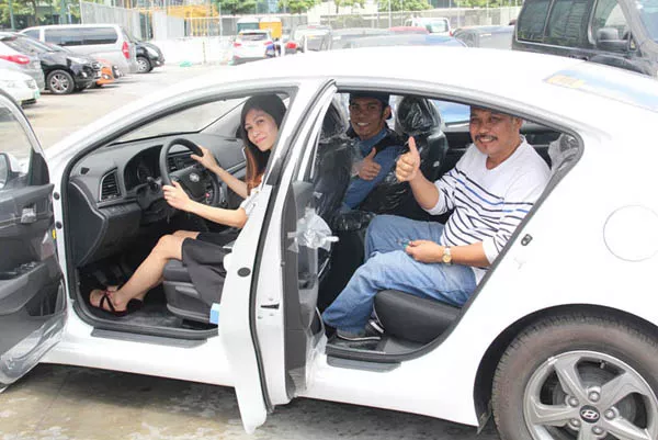 three persons in a one car