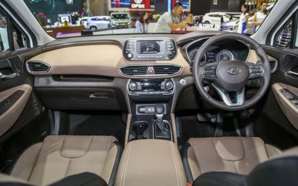 Stepping inside, the cabin shows a more premium feel than the previous model’s Hyundai Santa Fe 2019 dashboard area