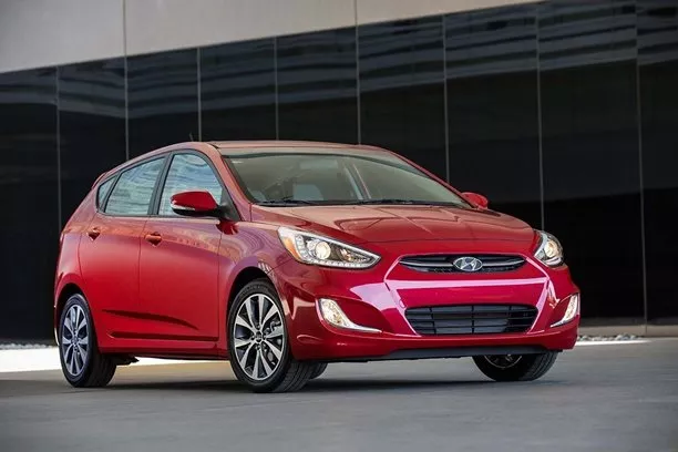 A red Hyundai Accent angular front view