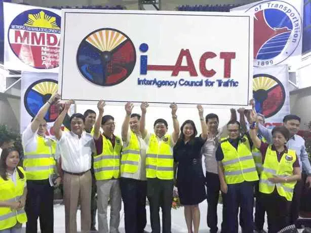 i-ACT's traffic personnels holding an i-ACT board