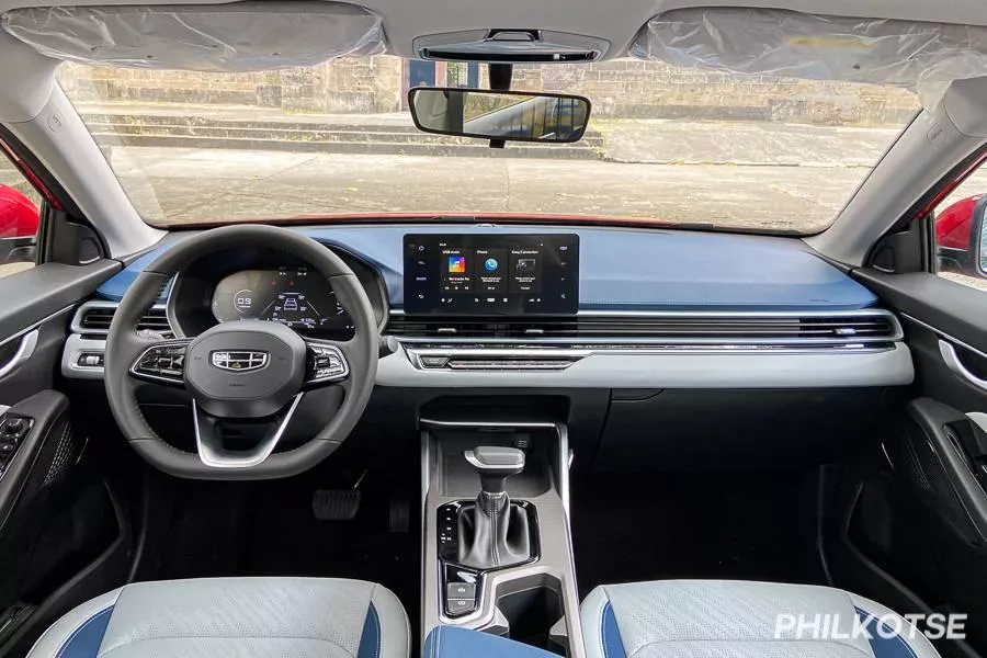 A picture of the Geely Emgrand's interior highlighting the dashboard and steering wheel