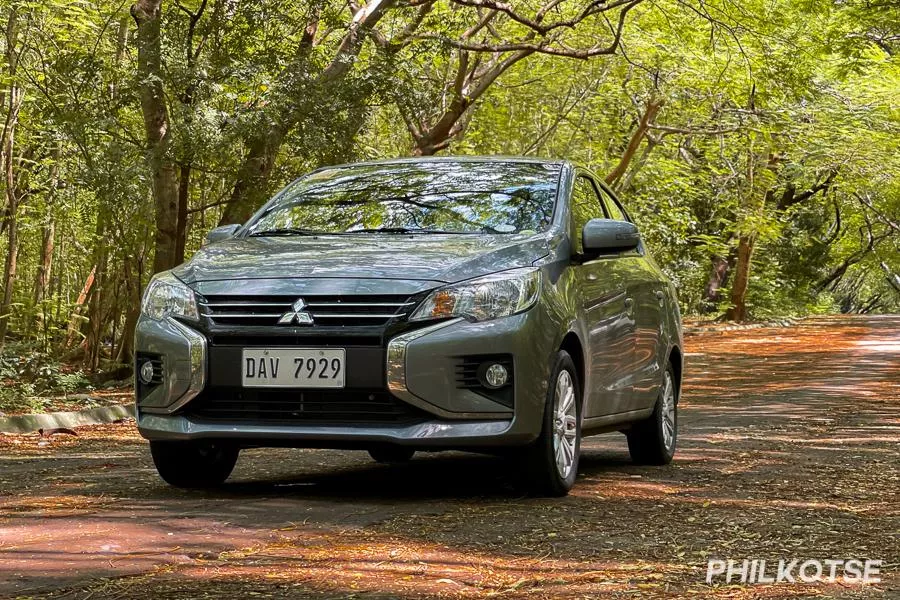 A picture of the Mitsubishi MIrage G4 in a wooded, shady area.