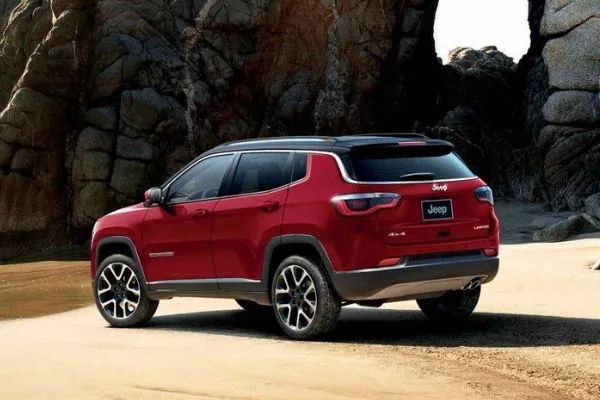 A picture of a Jeep Compass on the beach
