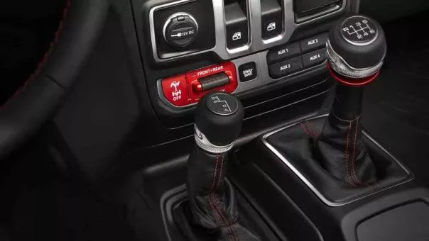 The dashboard, start/stop button, and automatic climate control are also new Jeep Wrangler 2018 controls